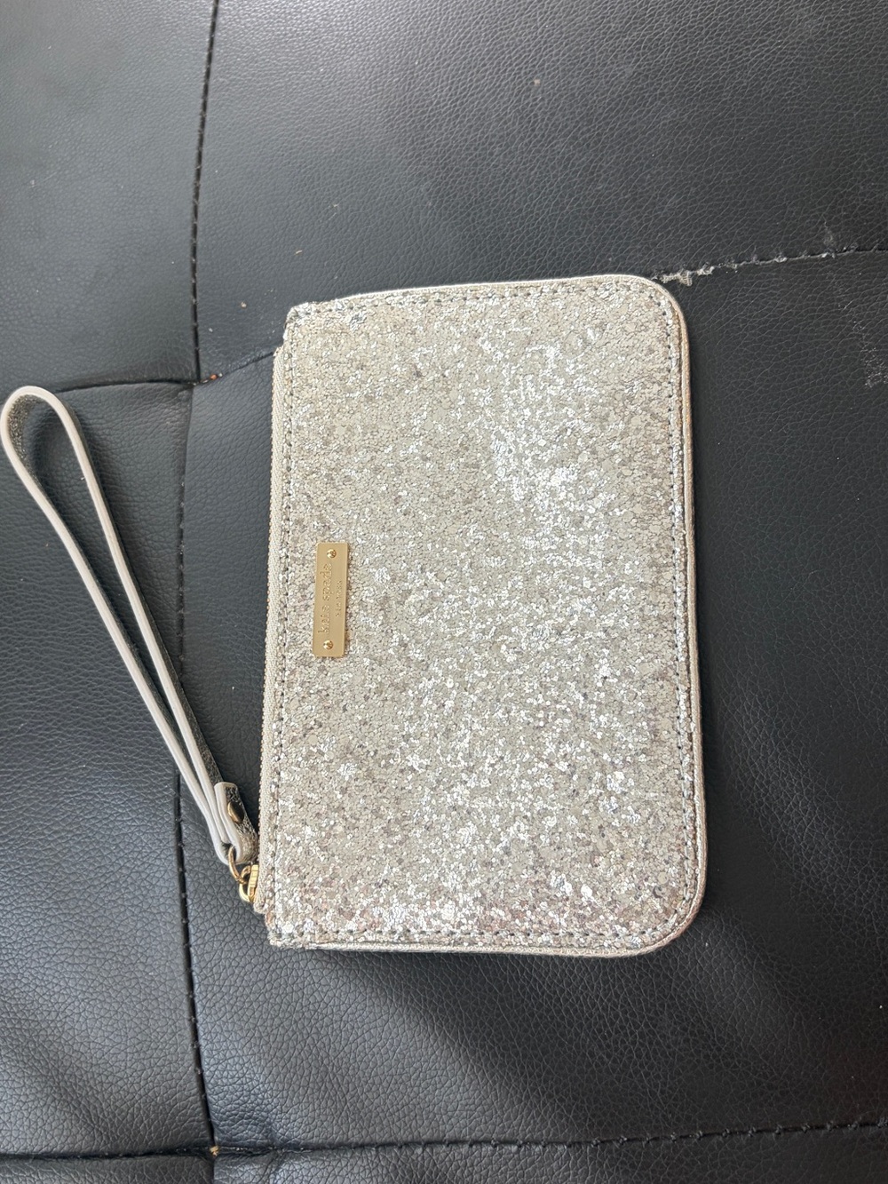 kate spade Silver Glitter Wristlet with Gold Plaque